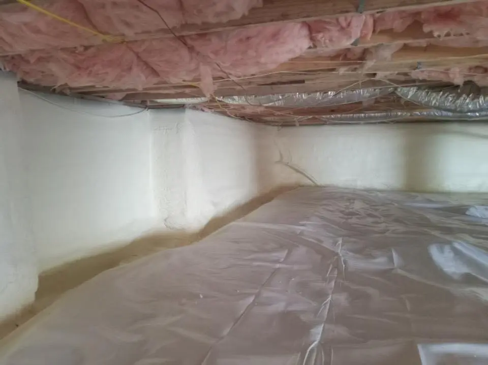 Crawl space encapsulation with closed-cell spray foam for Commercial Roof Restoration in Fairmont